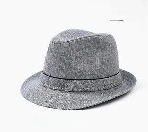Detail showing grey linen texture weave and black ribbon band on a classic trilby hat