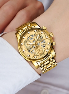 Detailed macro shot of the hollow mechanical gold watch dial with visible gears