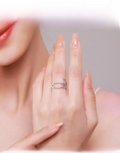 Detail of S925 sterling silver leaf ring with micro-pave white zircons on finger