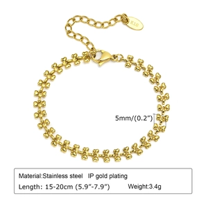 Detailed view of heart-link chain bracelet with K18 tag in vacuum gold-plated stainless steel