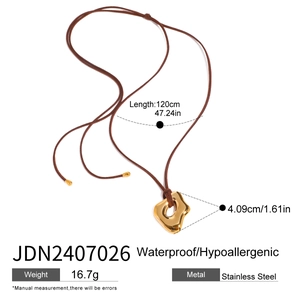 Detail view of gold liquid metal pendant on a brown cord necklace with 120cm length specs