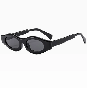 Close-up of stylish wavy black frame sunglasses with glossy finish and sleek lenses