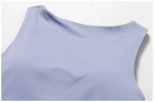 Detail of lavender yoga top featuring a wide boat neck and high-density matte fabric texture