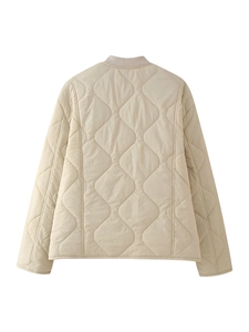 Macro view of the back of a beige diamond quilted bomber jacket with ribbed collar