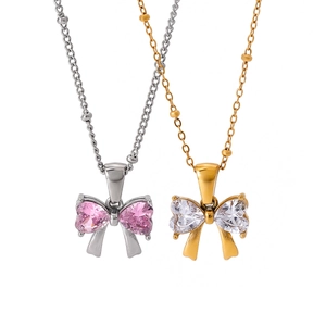 18k gold stainless steel bow necklace with heart-shaped zircon pendants on white background