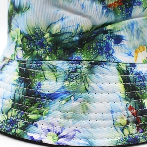 Women's reversible floral bucket hat with blue watercolor print and stitched brim