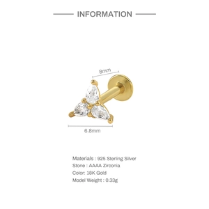 Macro detail of 18K gold plated 925 silver labret with three pear-shaped zirconia stones