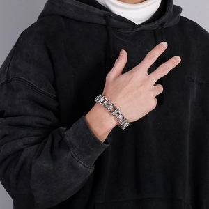 Punk skull bicycle chain bracelet in titanium steel shown on a male model wrist