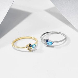 Elegant S925 sterling silver ring featuring blue and clear zircon stones in a minimalist style