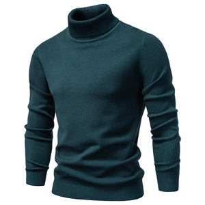 Detailed close-up of teal turtleneck sweater featuring ribbed cuffs and side stripe knit