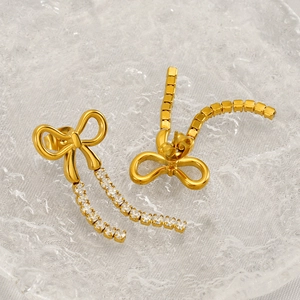 Elegant gold bow earrings with crystal tassel drops and polished finish for women
