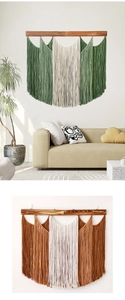 Detail of bohemian macrame wall hanging with wooden rod and fringe in green and beige