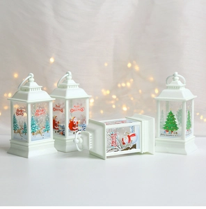 Set of four white vintage LED Christmas lanterns with festive Santa and reindeer prints