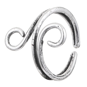 Detail of vintage hollow silver ring showing spiral textured lines and antique finish