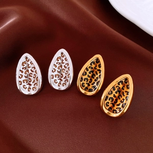 Detailed view of water drop leopard print earrings with gold and silver plated borders