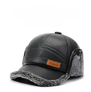 Detail view of winter baseball cap with faux fur earflaps and textured black leather