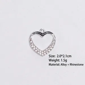 Detailed view of alloy heart pendant with rhinestones and black enamel lines