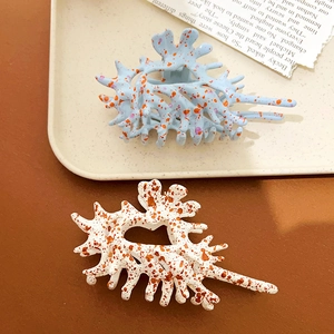 Oversized coral-shaped hair claws in blue and cream matte finish with hollow design