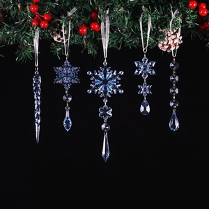 Close-up of blue acrylic snowflake ornaments and icicles on a decorated Christmas garland