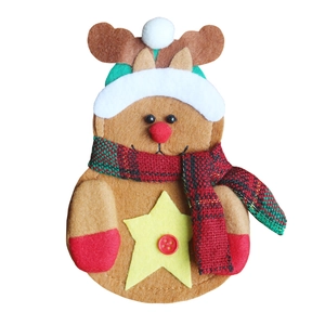 Detail of reindeer felt cutlery holder with red scarf and star for Christmas decor
