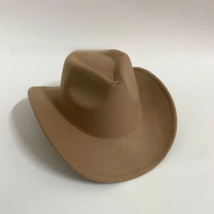 Detailed view of camel brown felt western cowboy hat with wide brim and fine stitching