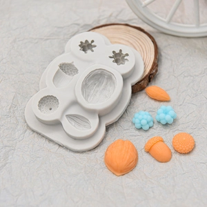 Silicone hazelnut and pinecone nut mold for chocolate fondant with finished samples
