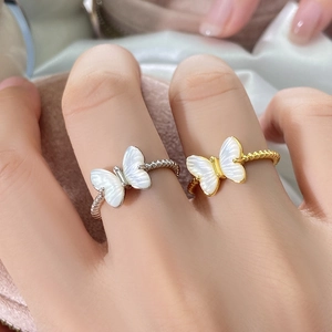 Elegant butterfly rings with mother of pearl and twisted bands in gold and silver finish