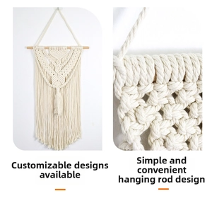 Detail of bohemian macramé wall hanging with natural cotton rope and wooden rod