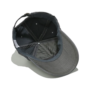 Detail of 100% cotton washed baseball cap interior with reinforced seams and metal buckle