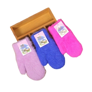 Detailed view of three pairs of plush rabbit fur gloves in pink, blue, and rose red