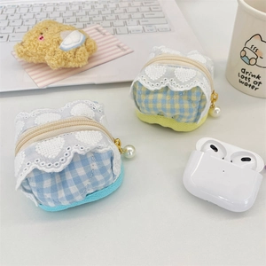 Detail of fabric earphone case with blue plaid pattern and lace heart embroidery edges