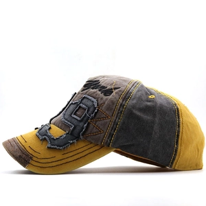 Detail of vintage washed baseball cap with number 9 patch and York embroidery