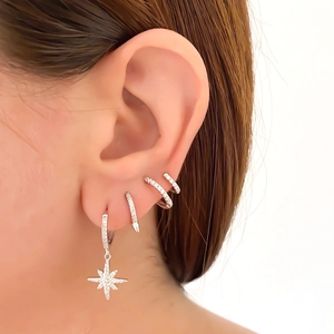 S925 silver double hoop earrings set with zircon star pendant worn on ear