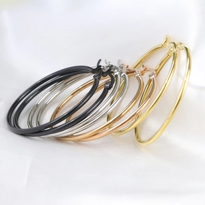 Detailed macro shot of 50mm hoop earrings in black, silver, rose gold and gold finish
