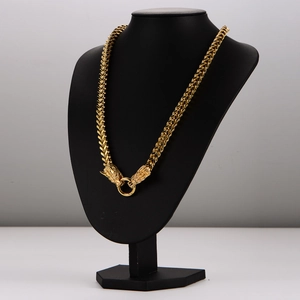 Men's gold-plated double dragon head Franco chain necklace on professional mannequin