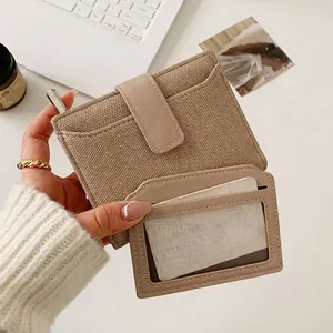 Women's minimalist beige short bi-fold wallet with multi-card slots and ID window
