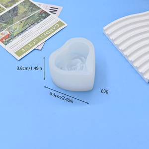 Heart-shaped rose silicone mold for DIY candles and soap making with floral relief pattern
