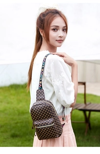 Detailed view of the small crossbody bag with clover patterns and LOVE letter straps