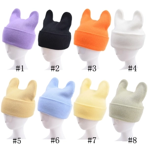 Cute knitted beanies with ears in 8 solid colors displayed on white mannequin heads