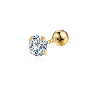 Detail of a four-prong gold nose stud with a round clear zircon and ball back closure