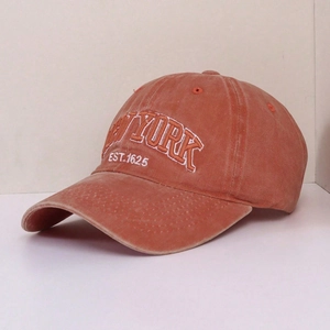 Vintage washed brick red baseball cap featuring white New York embroidery on the front