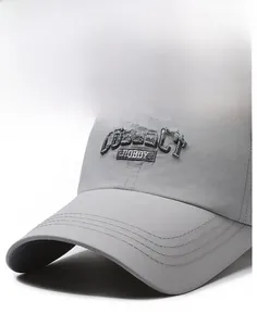 Close-up of the dark grey baseball cap featuring COLLECT HOBBY embroidery and structured brim
