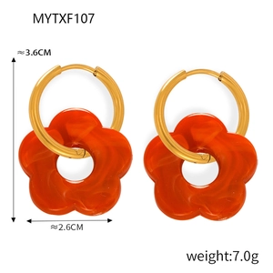 Detail view of flower earrings with size measurements and orange resin marble texture