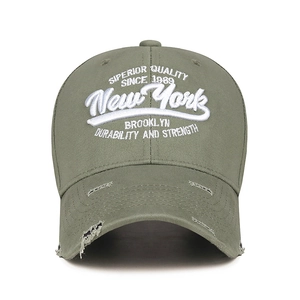 Army green baseball cap with white 3D embroidery and distressed ripped details on brim