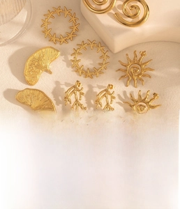 Golden titanium steel jewelry set featuring sea star, coral, and ginkgo leaf designs