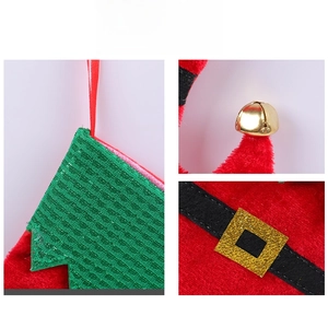 Detail of Christmas stocking with red velvet, green sequins, and a golden belt buckle