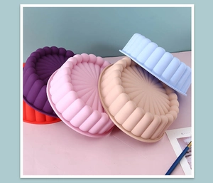 Macro detail of various colorful silicone cake molds with fluted sunflower patterns