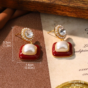 Macro view of vintage burgundy earrings with pearls and dimensions 3.3cm by 1.6cm