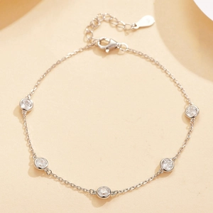 Detailed close-up of S925 sterling silver bracelet with five round clear zircon stones