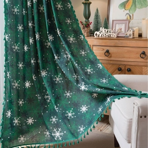 Green Christmas curtain with white snowflake patterns and tassel edges for home decor